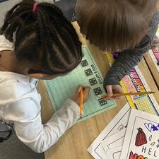 two students working together on literacy activity