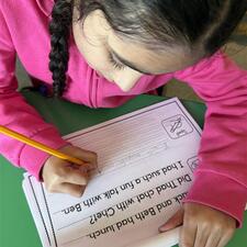 student practicing written work