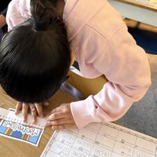 student measuring with a ruler
